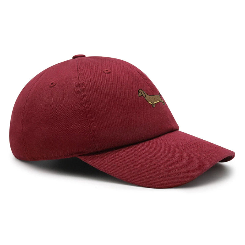 A collection of Dachshund baseball caps in various colors, all featuring a small embroidered dachshund design on the front.