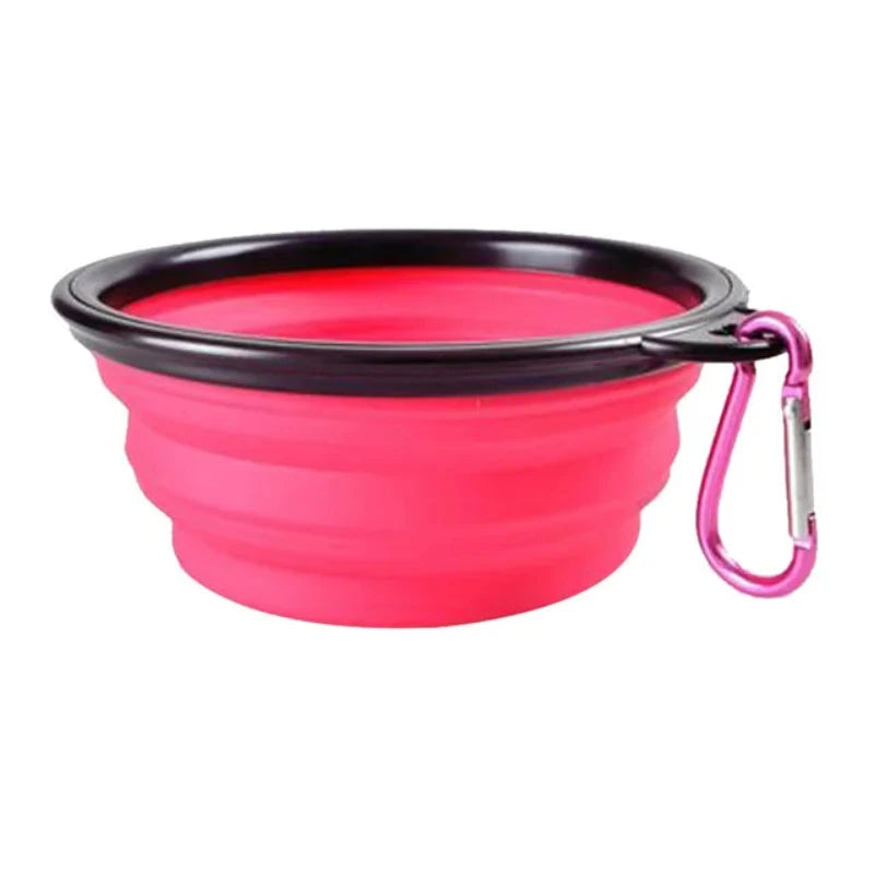 A variety of collapsible dog bowls in multiple solid colors, displayed in an open black bowl with a silicone edge.