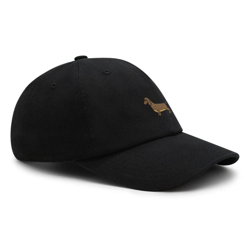 A collection of Dachshund baseball caps in various colors, all featuring a small embroidered dachshund design on the front.