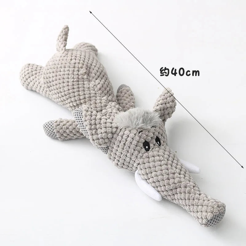 Knitted elephant toy with measurements on a white background
