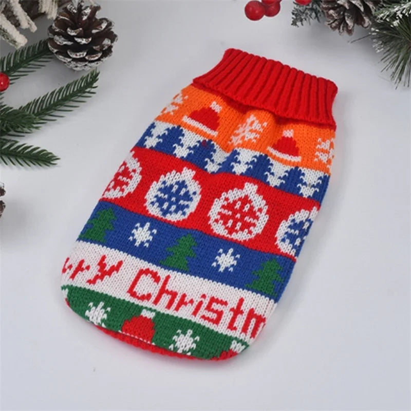 Christmas-themed knitted dog sweater with colorful patterns on a white background.
