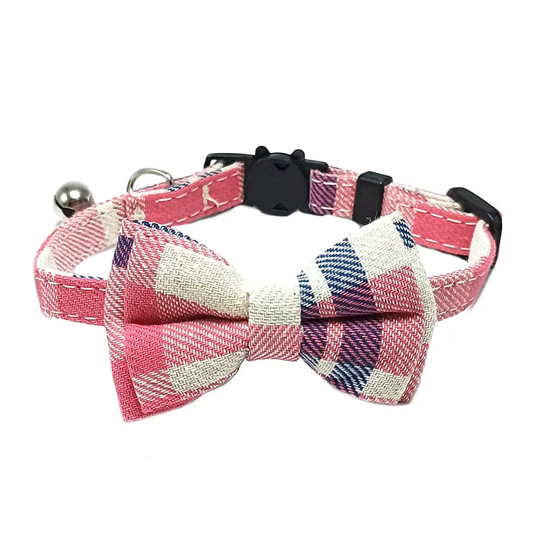 Pink plaid bow tie cat collar with a bell on a white background