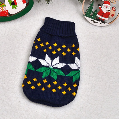 Knitted dog sweater with festive pattern on a textured surface
