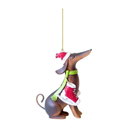 Christmas ornament of a dachshund wearing a Santa hat and scarf on a white background
