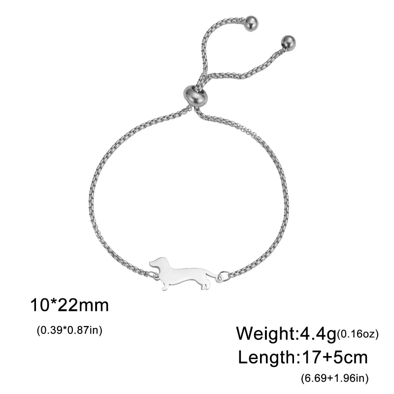 Silver bracelet with a dog design on a white background