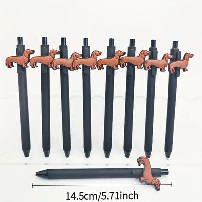 Set of black pens with dachshund-shaped clips on a white background