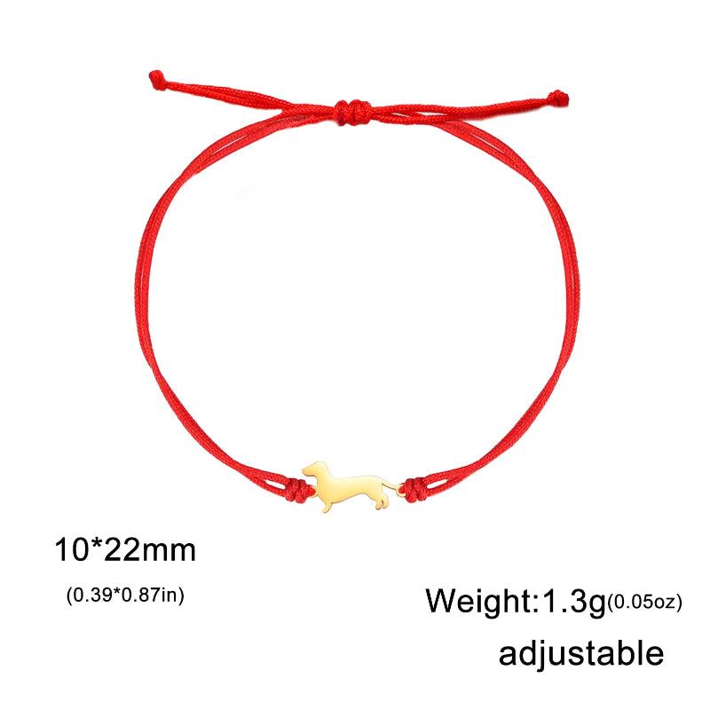 Red adjustable bracelet with a small yellow charm on a white background