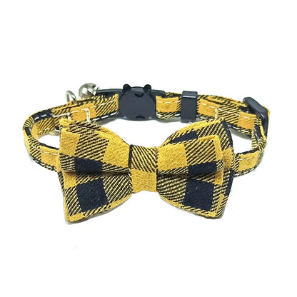 Yellow and black checkered bow tie dog collar on a white background