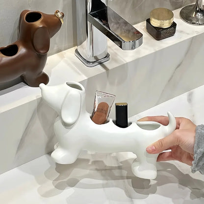 White dog-shaped holder on a bathroom counter with a hand placing items inside.